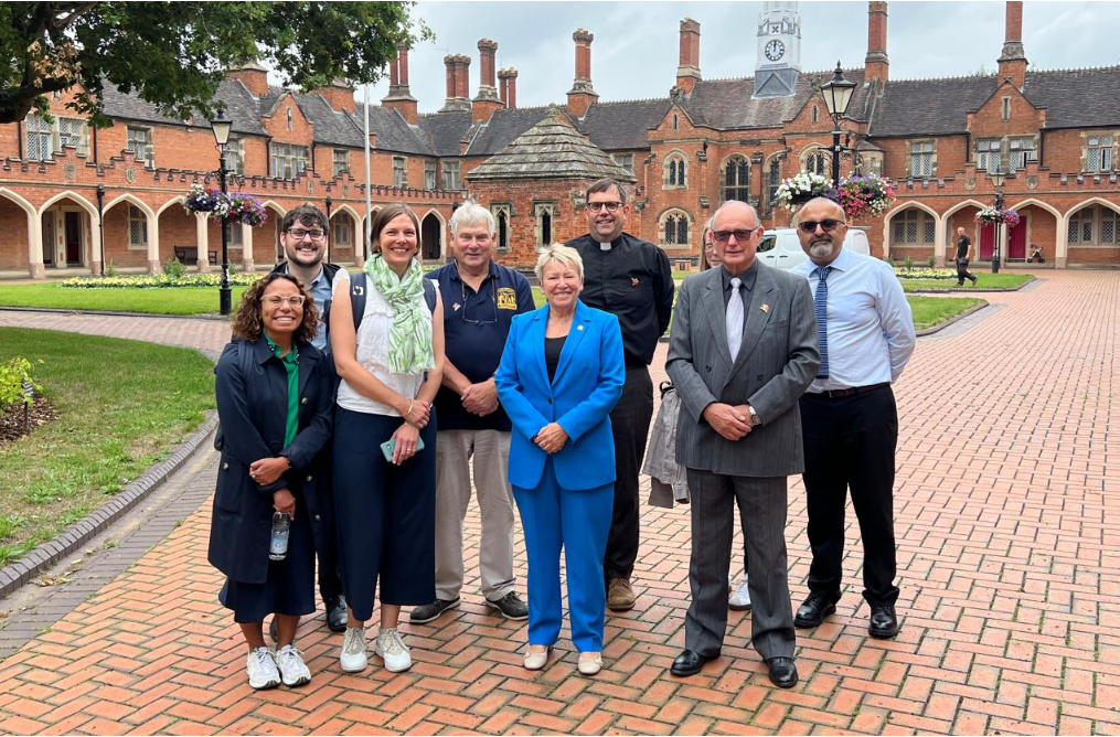 A group picture of people standing together from the government